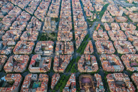 Aerial view of Barcelona Eixample residencial district with famous urban grid, Spain. Late afternoon light